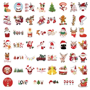 Detailed flat lay of festive Christmas stickers with Santa, reindeer and snowman designs