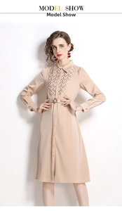 Detail of light apricot shirt dress featuring premium woven panel and matching belt