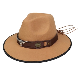 Detailed view of camel western cowboy hat with brown leather band and silver bull head buckle
