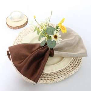 Daisy flower napkin ring with eucalyptus leaves and pearls on a fabric linen napkin