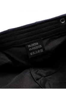 Detail view of the inner lining and fabric care label showing 70% cotton and 30% polyester
