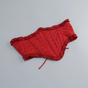 Detail of red hollow embroidery waist belt with ruffles and adjustable lace-up design