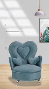 Detailed view of sofa-shaped jewelry box with heart backrest and silver metal feet