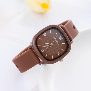 Retro square brown quartz watch for women with silicone strap on a floral background