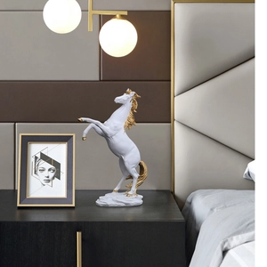 Elegant white and gold horse sculpture with dynamic rearing pose for luxury home decor