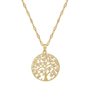 Close-up of golden tree of life pendant with sparkling cubic zirconia on a fine chain
