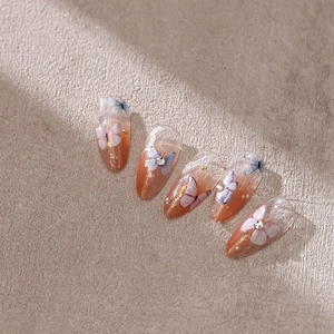 Matte orange gradient butterfly press-on nails with glitter, rhinestones and lettering