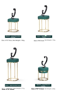 Detail view of dark green velvet watch display stands with gold metal base and C-rings
