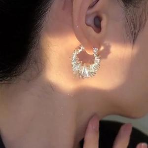 Silver hollow irregular hoop earrings for women featuring sparkling geometric facets