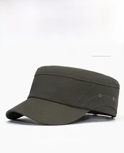 Detailed close-up of army green cotton military cap featuring a silver metal W logo