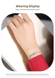 Close-up of S925 silver moissanite bracelet with square cut stone on female wrist