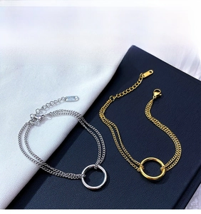 Detail of adjustable double-layer chain bracelet with S925 engraved silver and gold rings