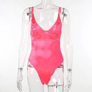Detail of rose red satin bodysuit featuring thin straps and smooth silk texture