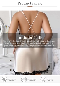 Detail of cross back straps and black lace trim on champagne silk satin nightgown