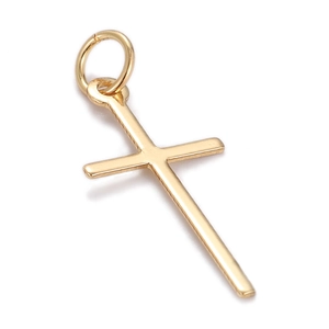 Detailed view of polished gold cross pendant with smooth metallic texture and bail
