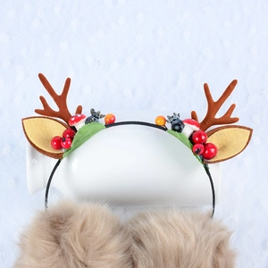 Christmas reindeer antler earmuffs with cute plush brown fur and festive berry details