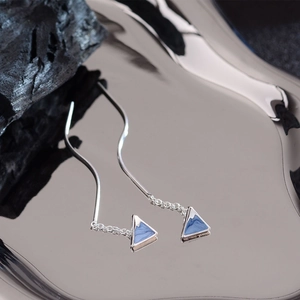 Elegant blue marble triangle dangle earrings with long silver threader chains on metal tray