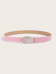 Detail of pink PU leather belt for women with silver oval metal buckle and adjustment holes