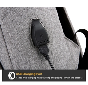 Detail showing the external USB charging port and data cable on a grey laptop backpack