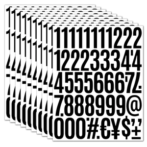Macro detail of 2 inch waterproof black vinyl number and currency symbol sticker sheets