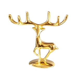 Luxury golden deer figurine with antlers for jewelry display on stable round base