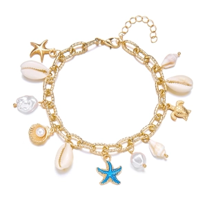 Bohemian gold layered bracelet with starfish shells pearls and turtle charms