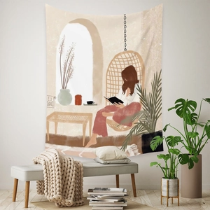 Detail of Bohemian tapestry showing a woman reading in a hanging chair on a white wall