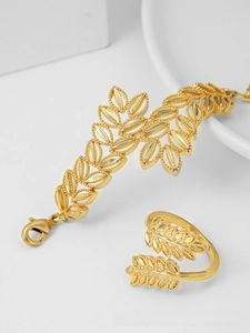 Detailed view of gold-plated leaf pattern bracelet and adjustable ring jewelry set