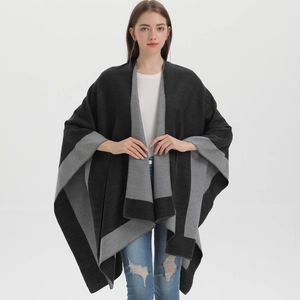Detail of the soft black and grey split-knit shawl cape for women with a reversible design