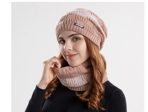 Close-up of pink and beige striped knit beanie and neck warmer set with JOYLORD label