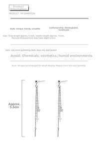 Detail view showing 5.5cm silver chain earrings with star and cross charms and dimensions