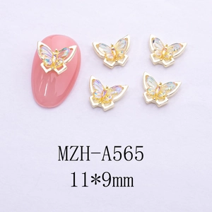 Detail view of gold butterfly nail charms with holographic resin and 11x9mm dimensions