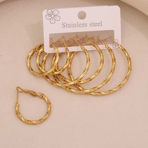 Detailed set of gold-plated stainless steel twisted hoop earrings on display card