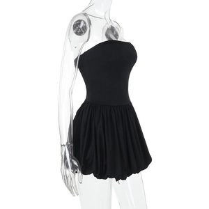 Side view detail of a black strapless mini bubble dress on a mannequin with slim fit cut
