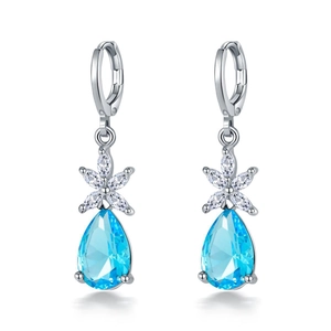 Elegant silver pear-shaped light blue stone earrings with zircon floral accents on white background
