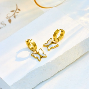 Elegant gold titanium steel hoop earrings with white shell butterfly charm pendant