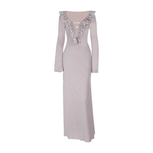 Detail of the plunging V-neckline with ruffled trim on a sparkly long-sleeve dress