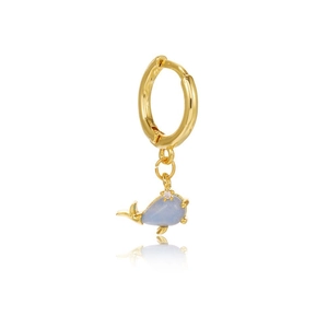 Detail of a gold whale earring with light blue enamel and a sparkling zircon stone