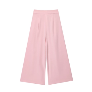 Detail of pink wide-leg trousers featuring elegant high waist and draped fabric texture