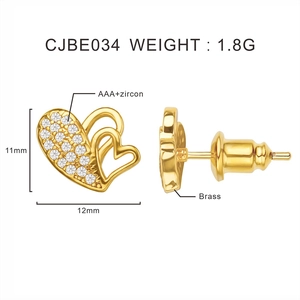 Detail view of gold heart stud earrings with cubic zirconia and size dimensions