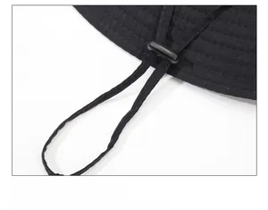 Detail of outdoor sun hat with adjustable chin strap and reinforced stitching on the brim
