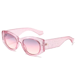 Pink glitter oval frame sunglasses with purple gradient lenses and metal accents