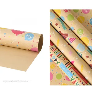 Detail of kraft paper birthday wrap rolls showing balloon prints and paper texture