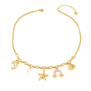 Marine style gold plated necklace with dolphin starfish pendants and pearls on white background