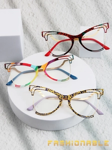 Three pairs of fashionable butterfly cat-eye eyeglass frames on geometric props