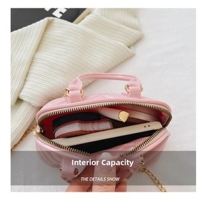 Internal view of the pink jelly handbag showing storage capacity for phone and makeup