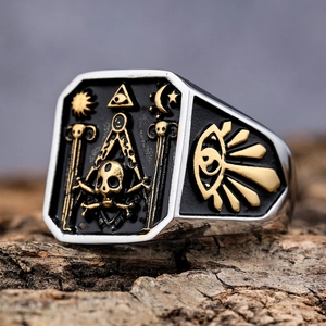 Gothic skull ring for men with Freemasonry symbols on rugged bark background