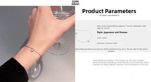Detail view of heart charm bracelet in titanium steel with 16cm plus 4cm extension chain