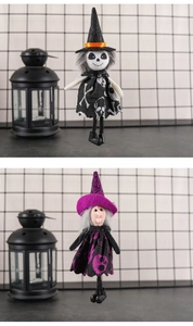 Detail of hanging Halloween wizard dolls in black, white and purple with skull patterns