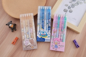 Flat lay of boxed 0.5mm mechanical pencil sets with bear, space, and girl themes